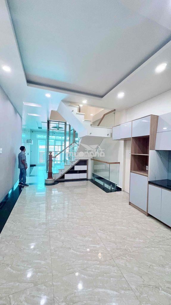 Cho thuê nhà nguyên căn mới xây 1 trệt 2 lầu 1 hầm sân xe hơi ,sân thư