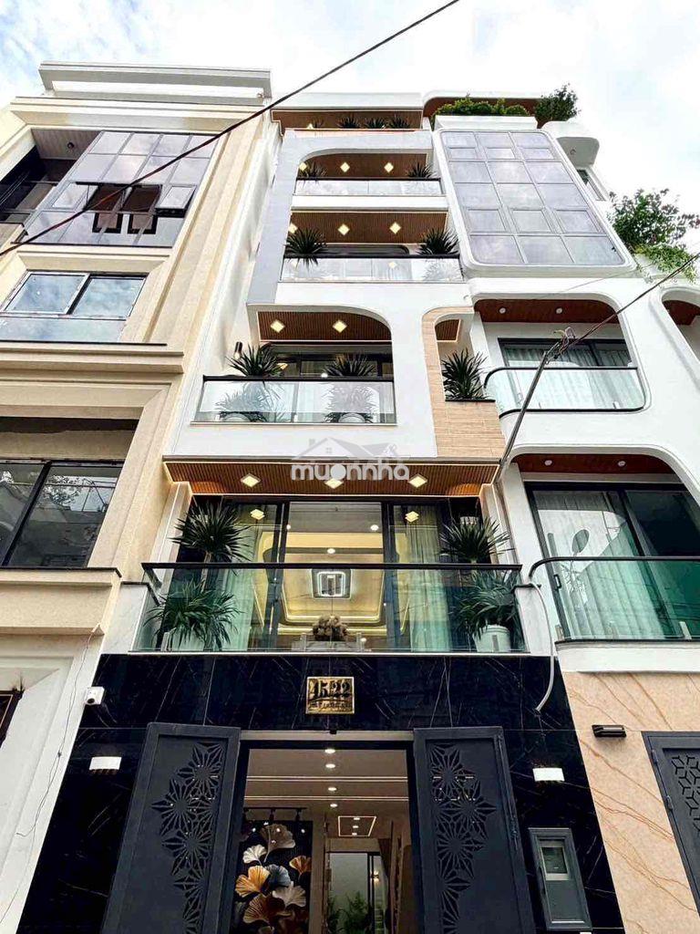 Nhà nguyên căn 1 trệt 1 lửng 4 lầu gara xe hơi hẻm oto full nội thất